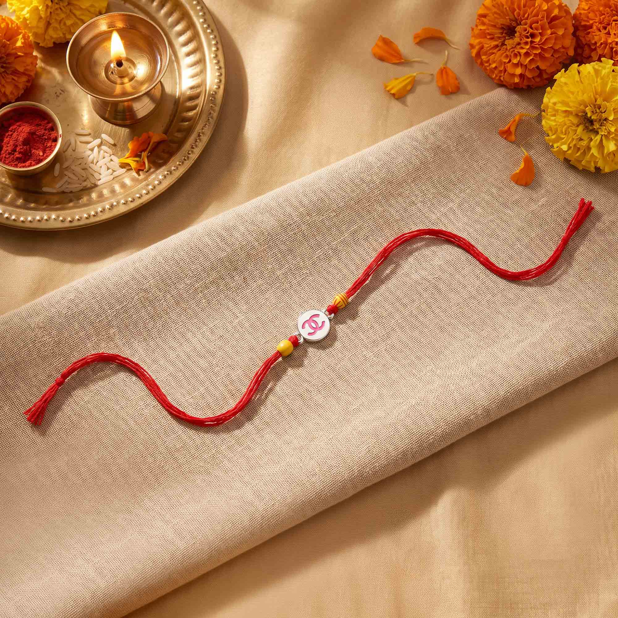 Pink Logo Silver Rakhi