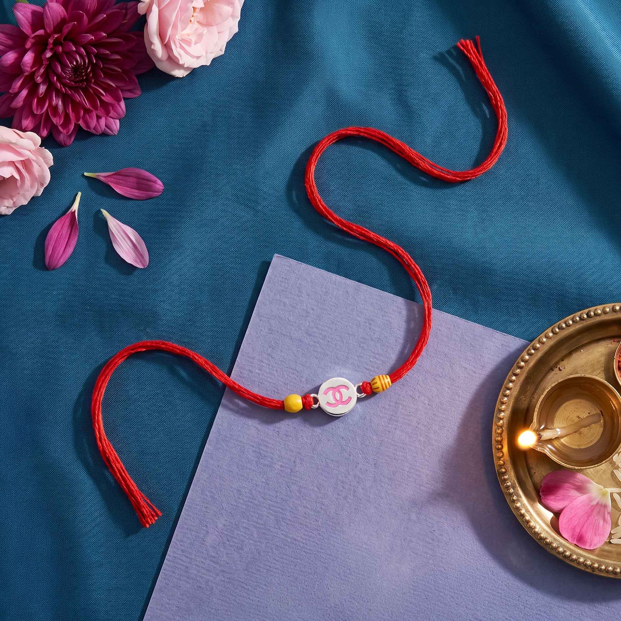 Pink Logo Silver Rakhi