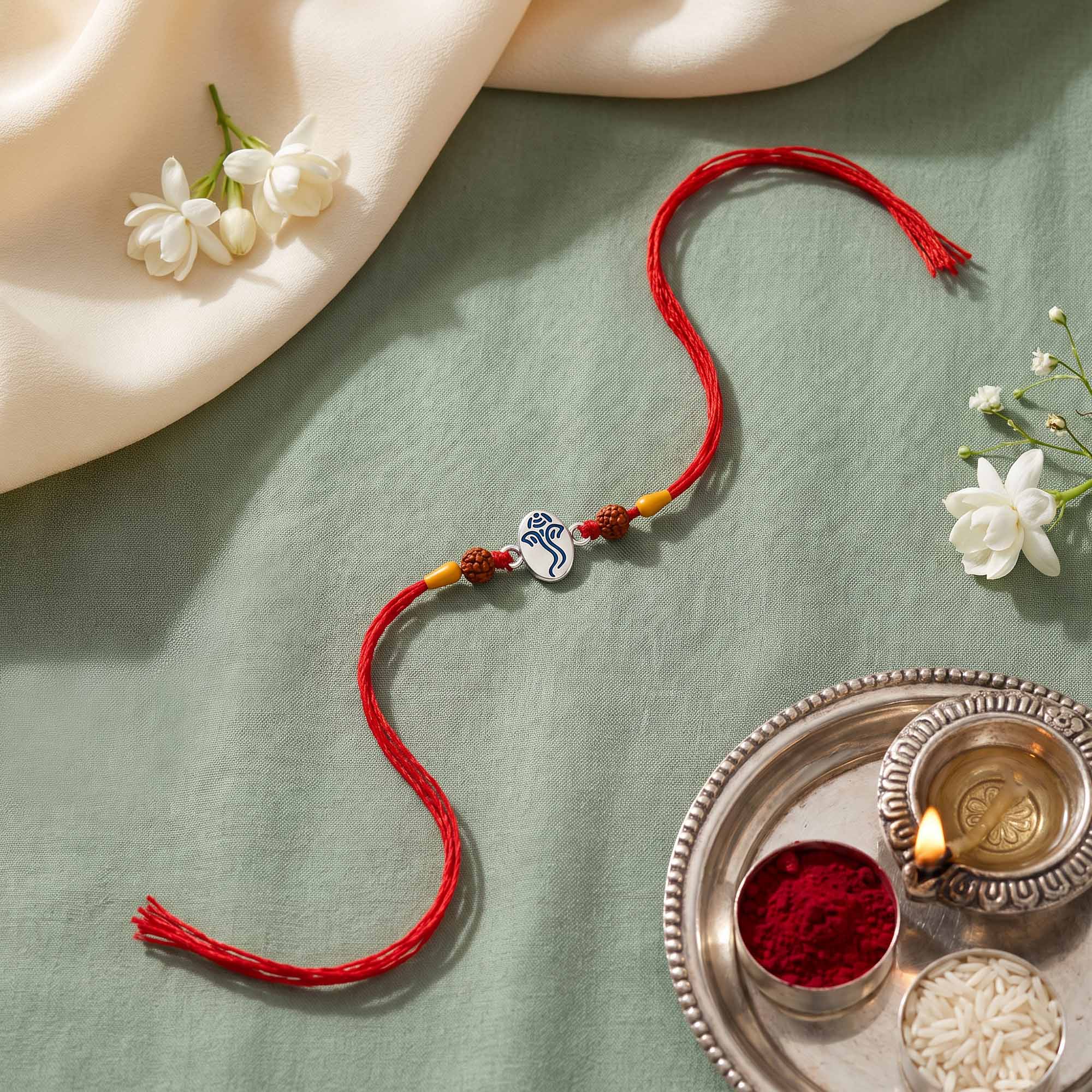 Ganesha Oval Silver Rakhi