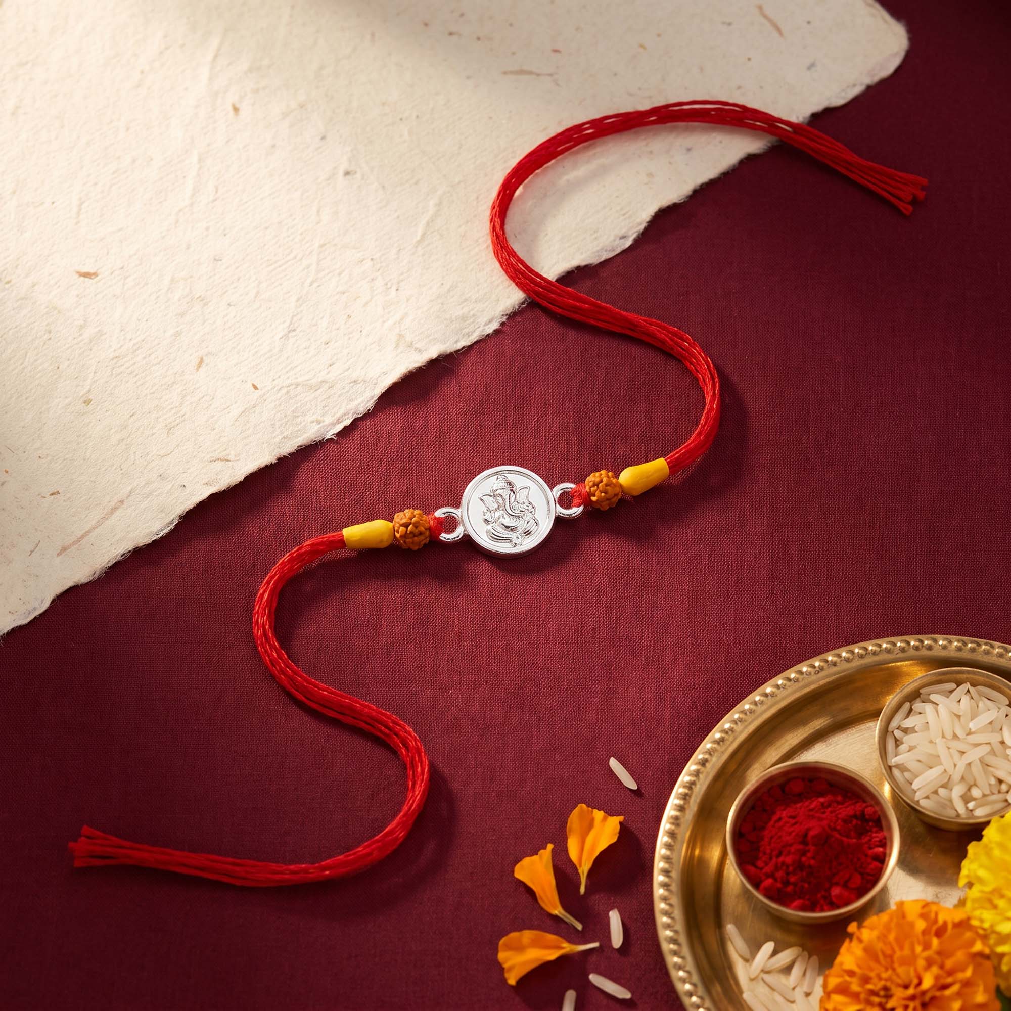 Silver Ganesha Red Thread Rakhi