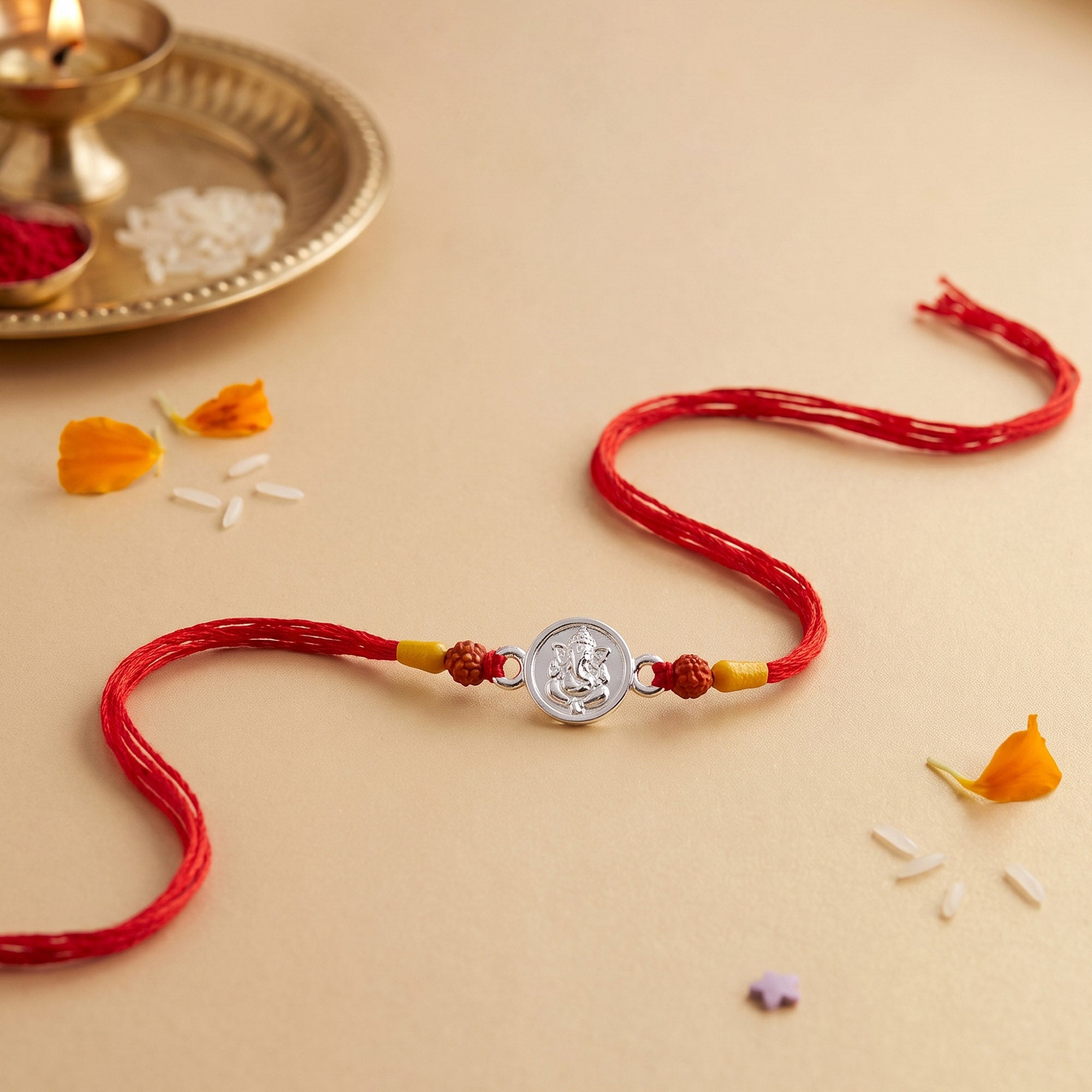 Silver Ganesha Red Thread Rakhi