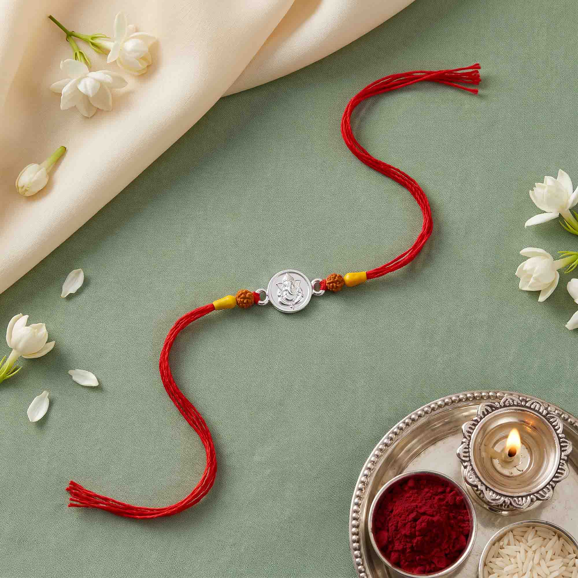 Silver Ganesha Red Thread Rakhi