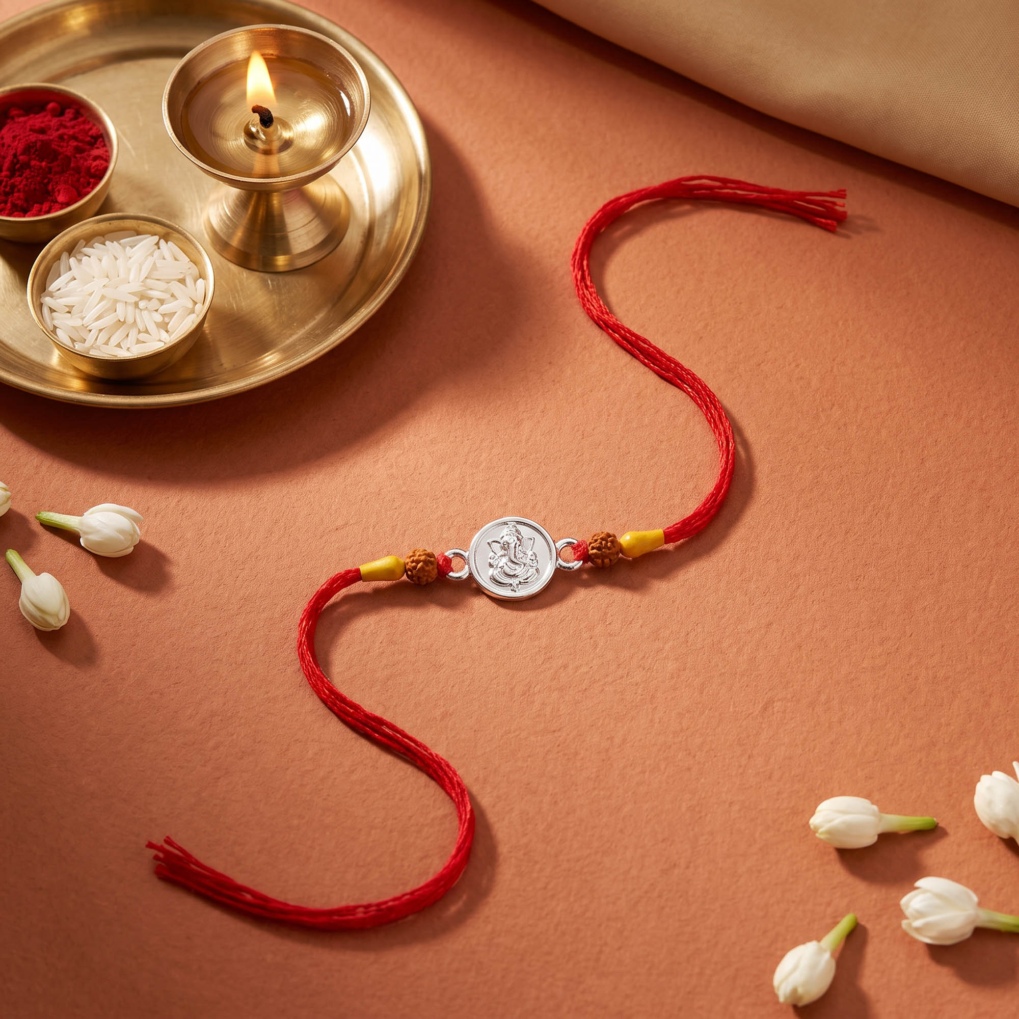 Silver Ganesha Red Thread Rakhi